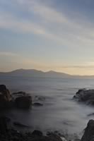 Ayrshire Coast Sunset, Portencross, Blue Sky, Scotland, Slow shutter.